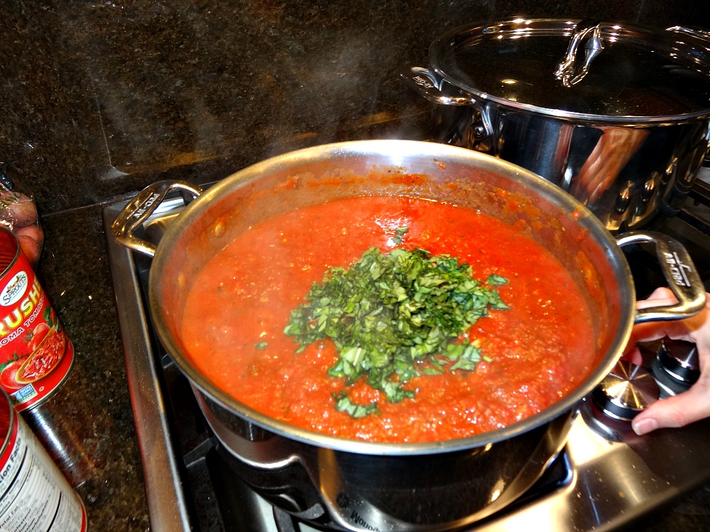 Adding basil to pasta sauce