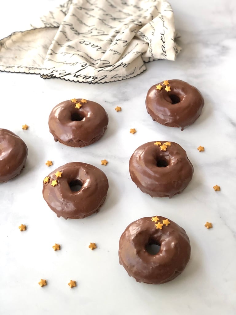 gluten-free chocolate donuts lined up on the counter