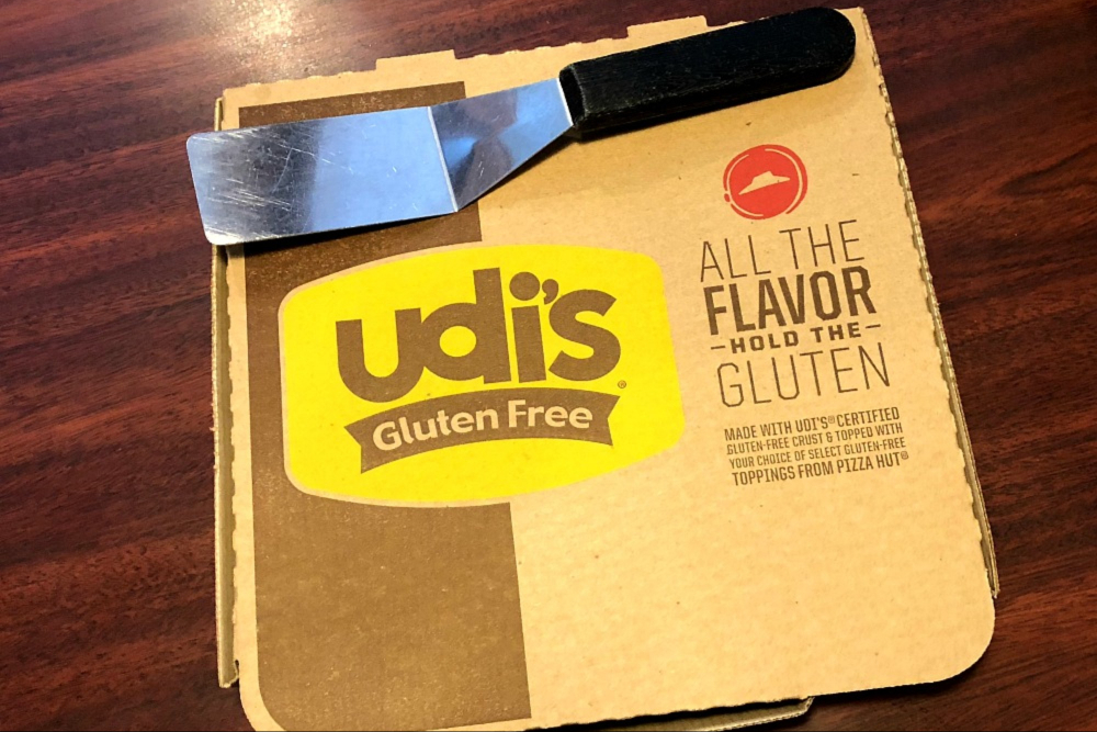 the gluten free pizza at Pizza Hut comes inside a labeled Udi's Gluten Free box.