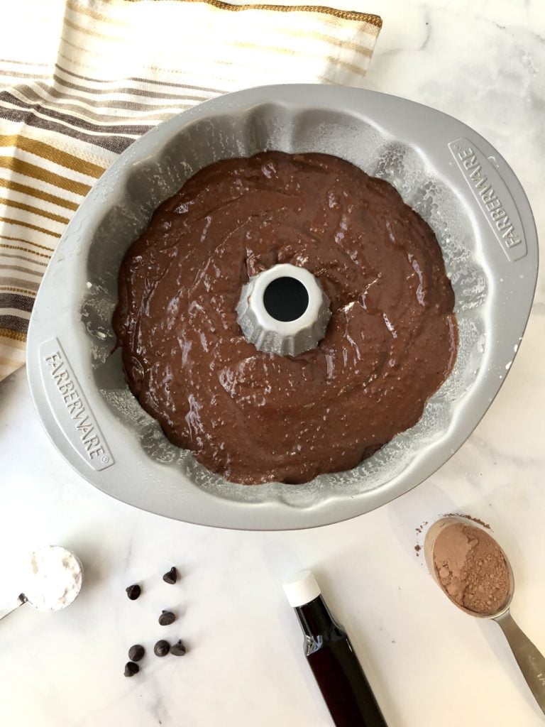 chocolate quinoa cake batter inside a bundt pan