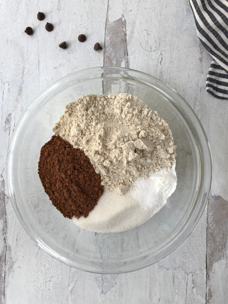 a bowl of the dry ingredients needed for pudding cake