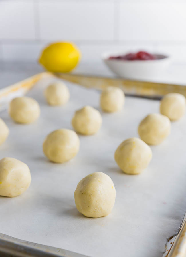 Gluten free thumbprint cookies rolled into dough balls