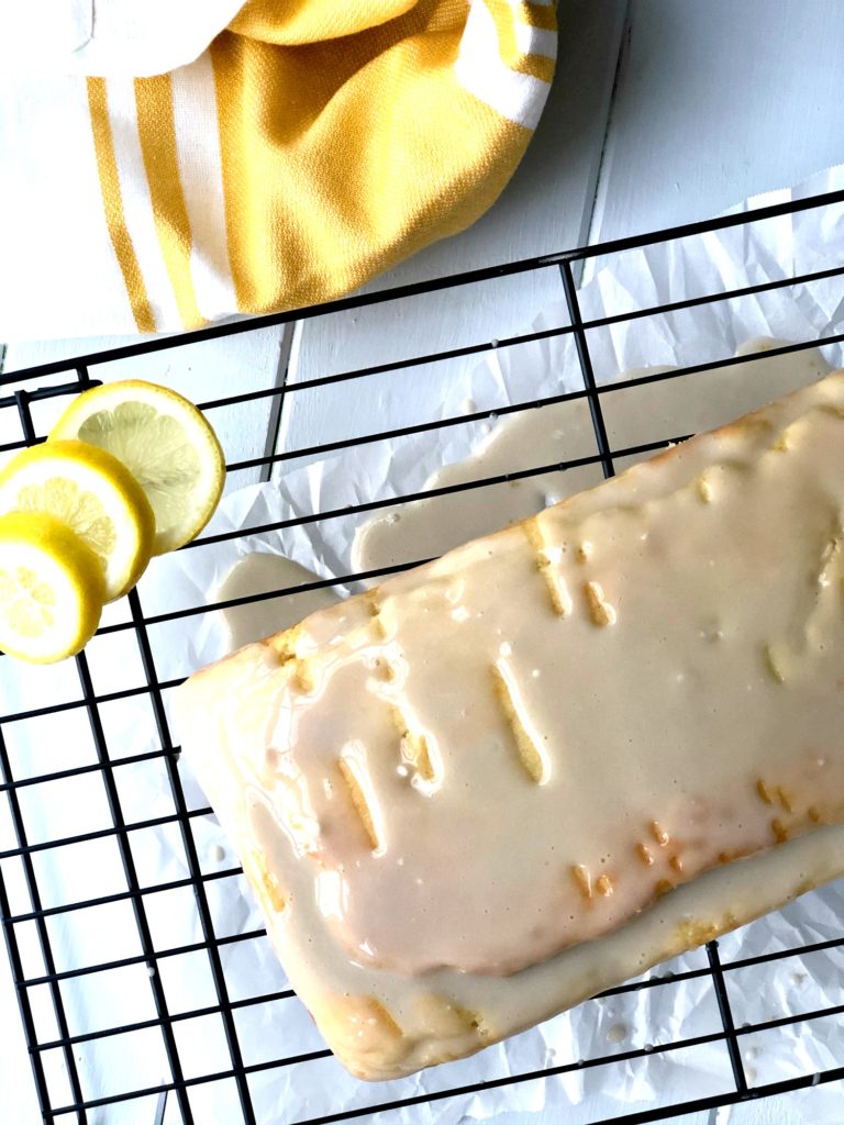Gluten-Free Lemon-Vanilla Pound Cake overhead view with lemons in picture