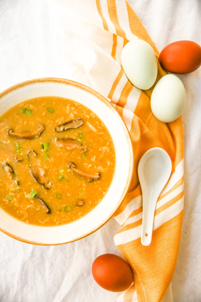 overhead happy egg drop soup with spoon and eggs