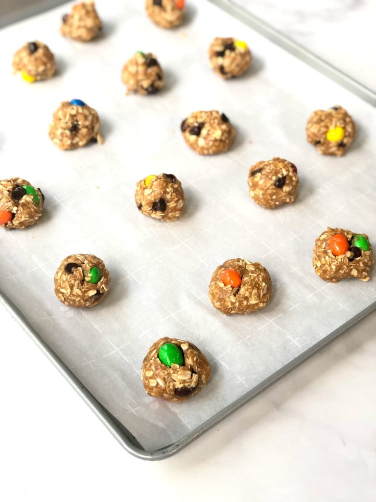 gluten-free monster cookie dough balls on baking sheet
