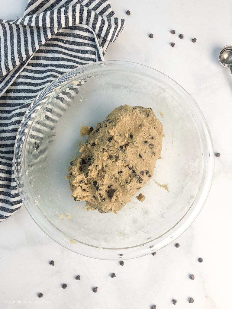 gluten-free chocolate chip cookie dough in a big mound ready to be rolled into balls