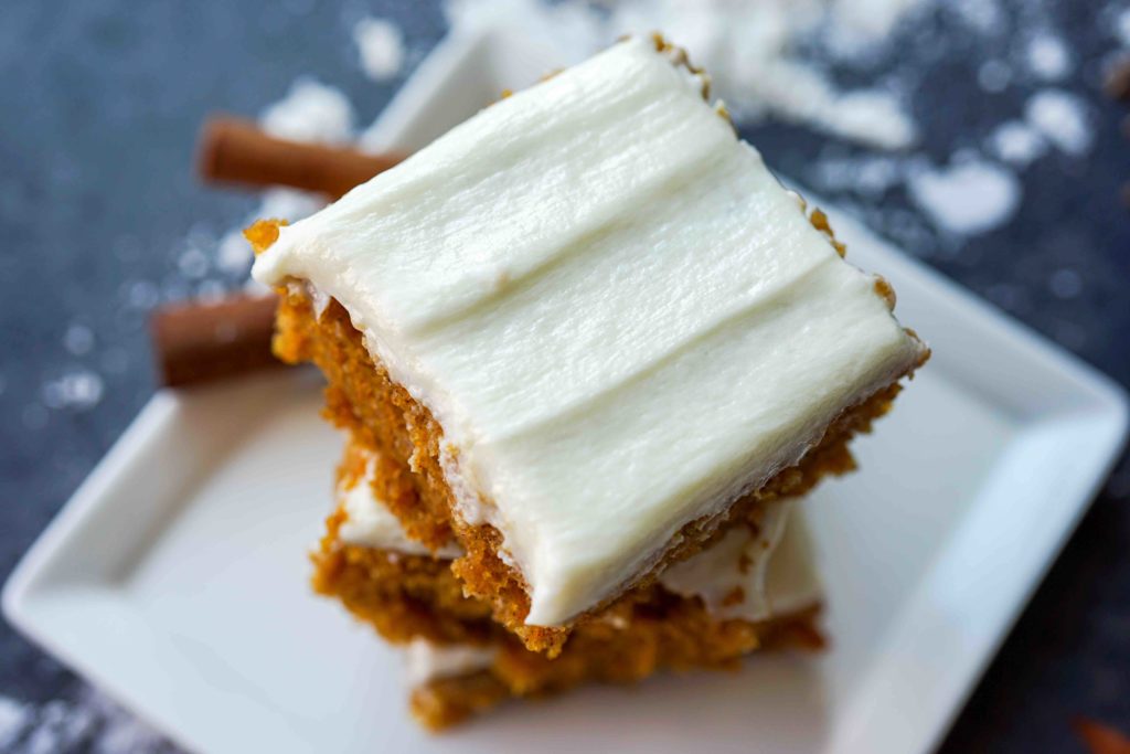 Gluten-Free pumpkin squares with cream cheese frosting top of stack photo