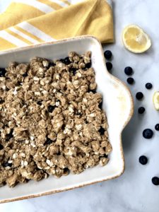 Blueberry crisp covered in oats and flour mixture