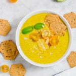 Upclose picture of summer corn gazpacho soup in a bowl - header image