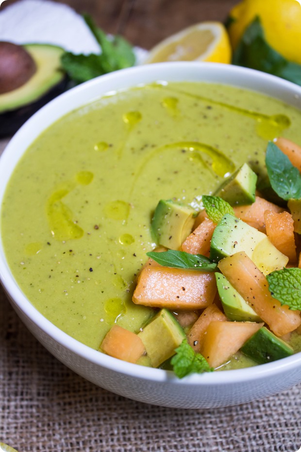 Upclose image of cantaloupe and avocado green soup.