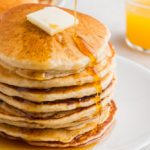 Header image of pancakes doused in maple syrup