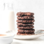 Stack of No Bake Mini Chocolate Peanut Butter Cookies with milk in background