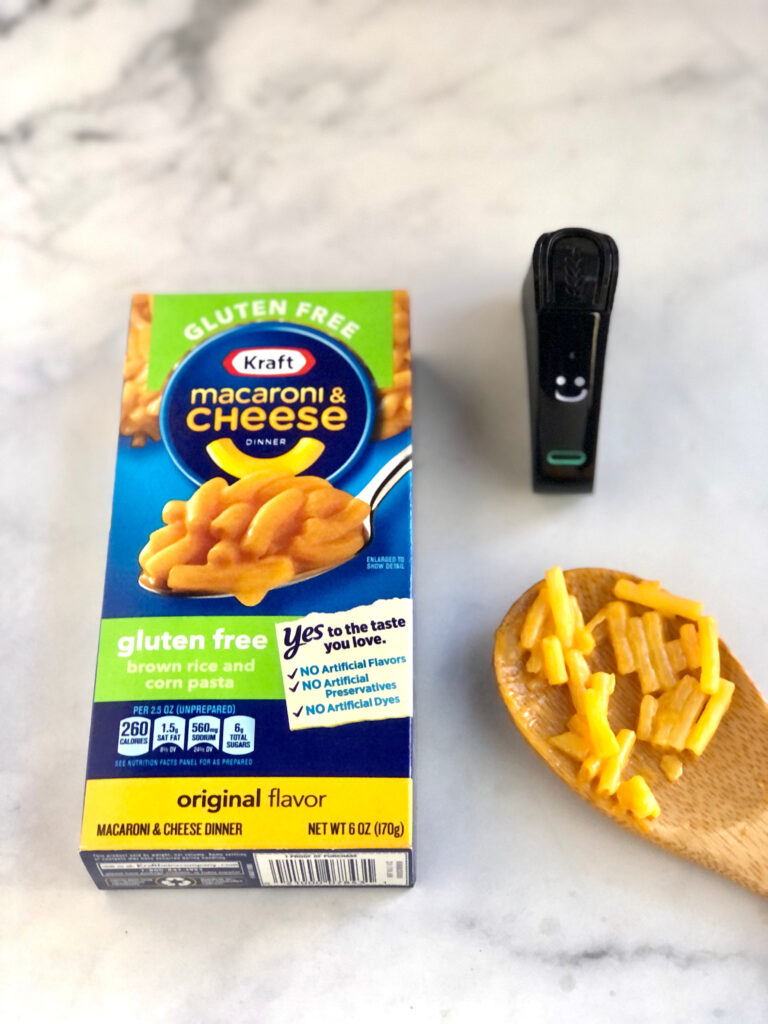 Nima Sensor displaying a smiley face after testing Kraft's gluten-free mac and cheese for hidden gluten.