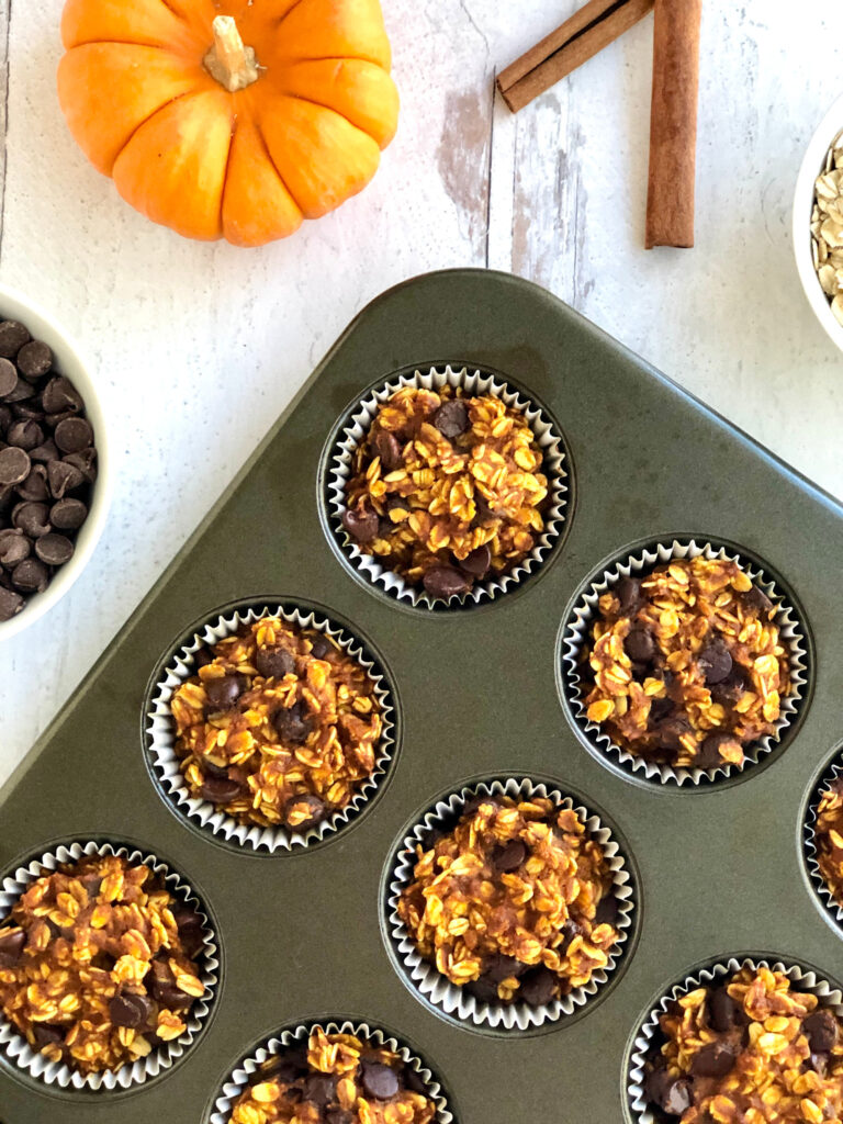 Cooked pumpkin oatmeal cups in a muffin pan