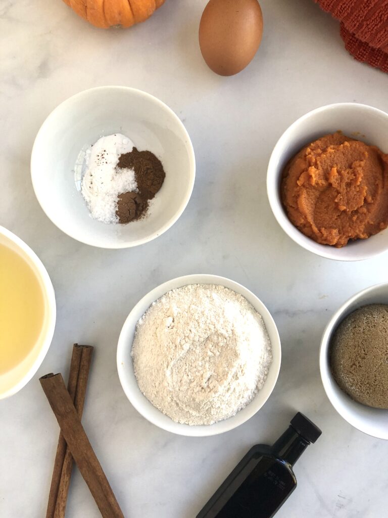 Picture of the cassava flour, melted butter, pumpkin puree and other ingredients needed for the cassava flour pumpkin cookies