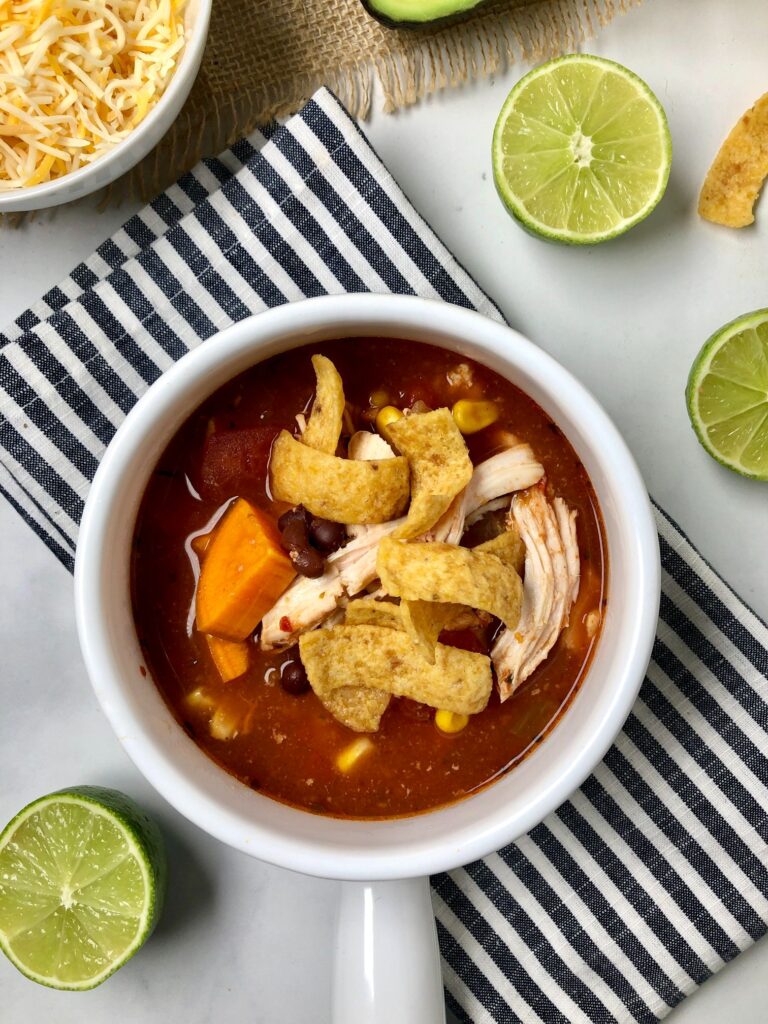close up on the chicken enchilada soup in a bowl