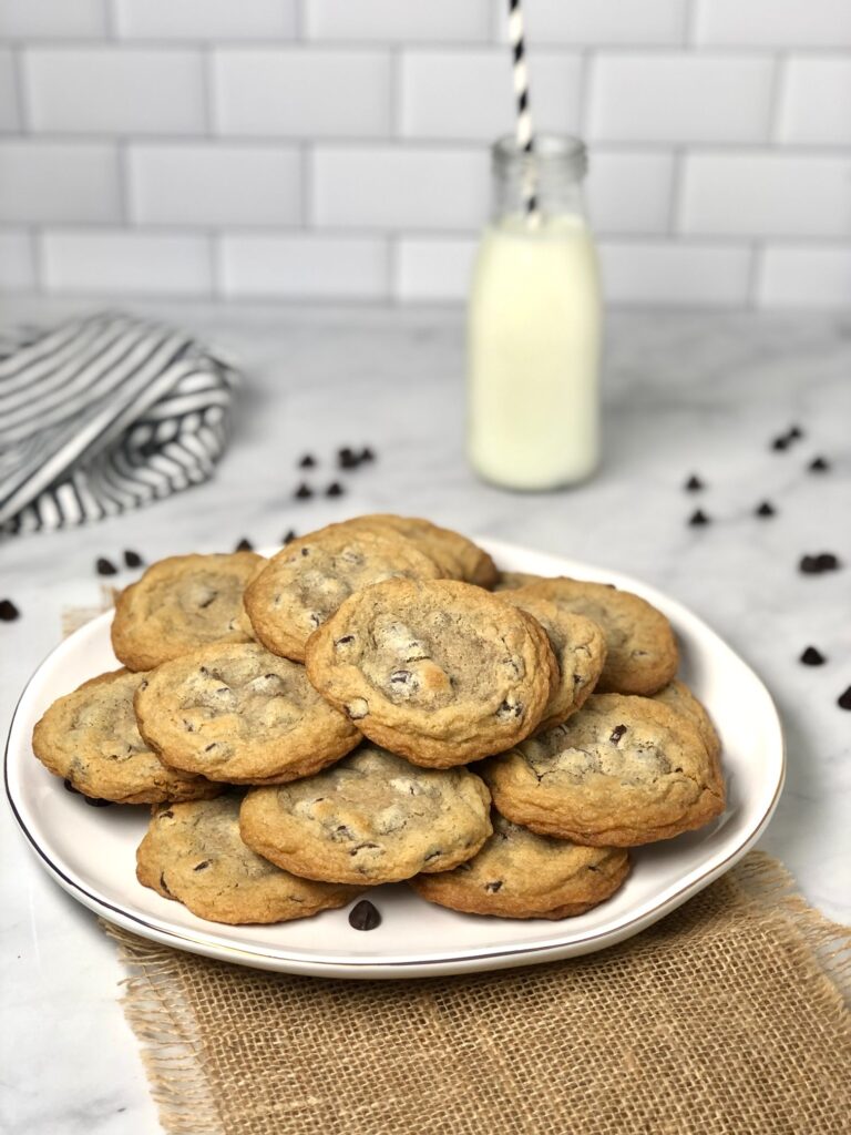 Plate of cassava flour chocolate chip cookies with glass of milk