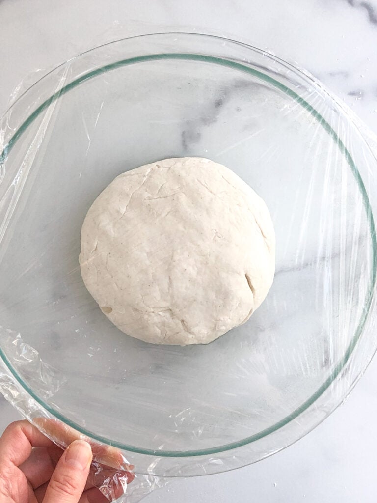 Cover pizza dough before rising