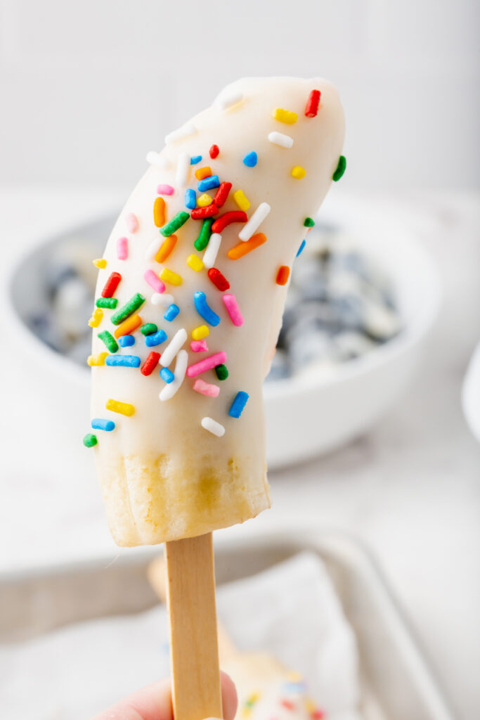 Close up picture of frozen yogurt banana pop on a stick