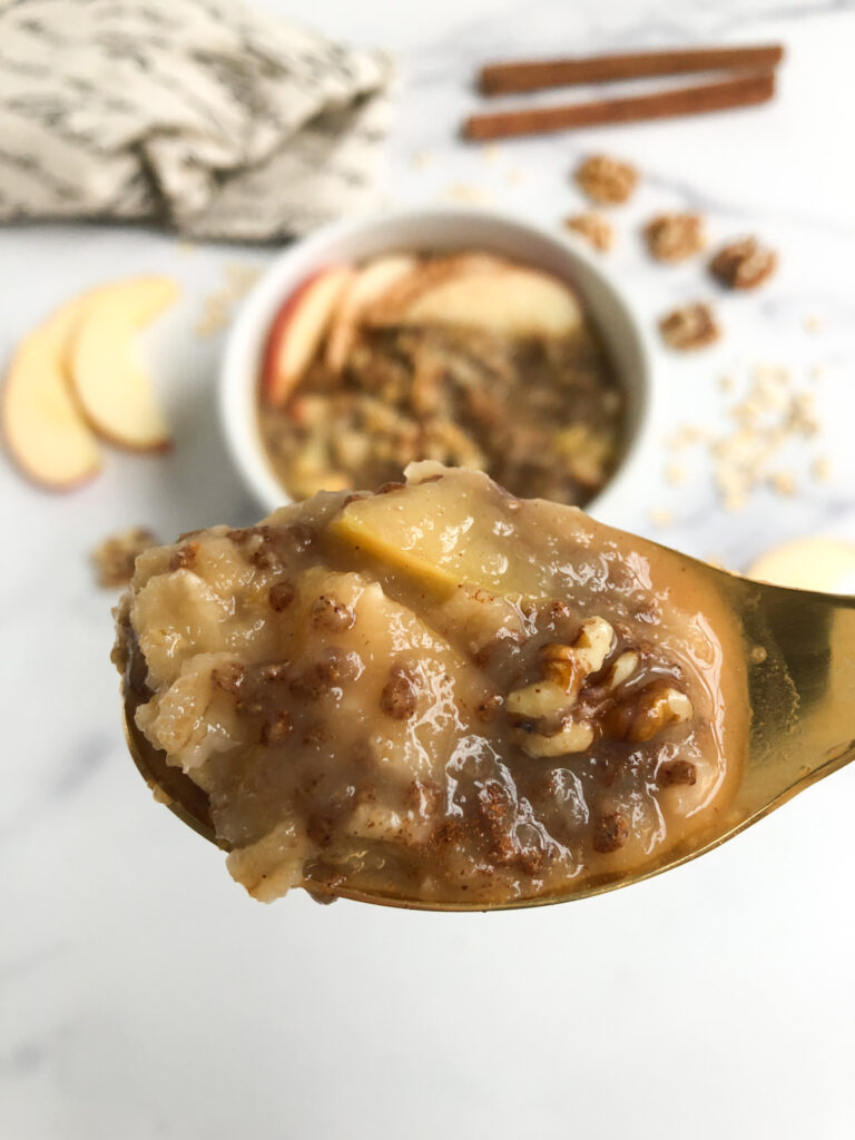 spoonful of apple pie oatmeal with chunks of visible apples