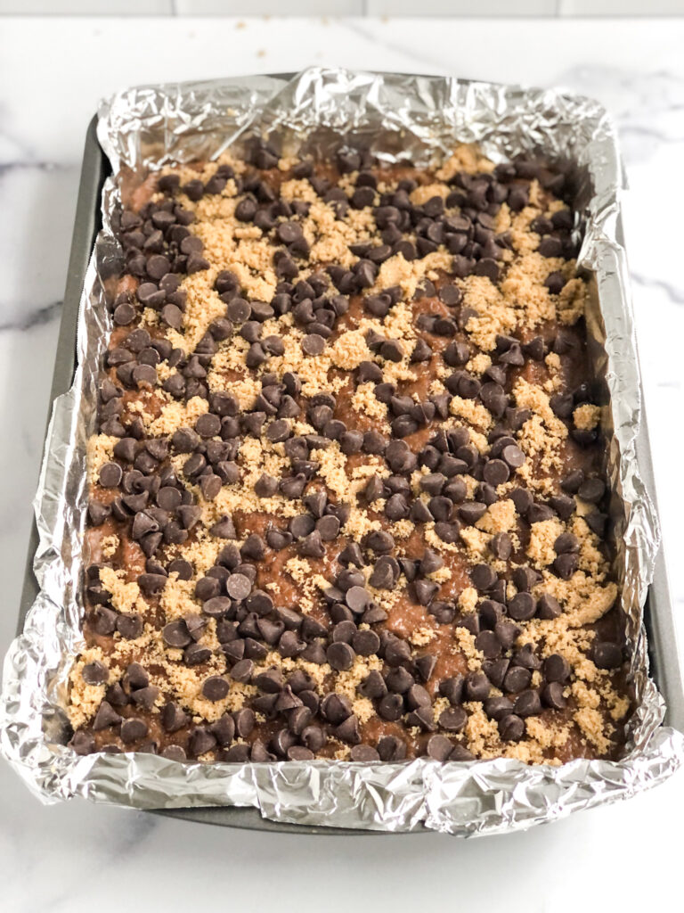 Cake coated with brown sugar and chocolate chips before baking