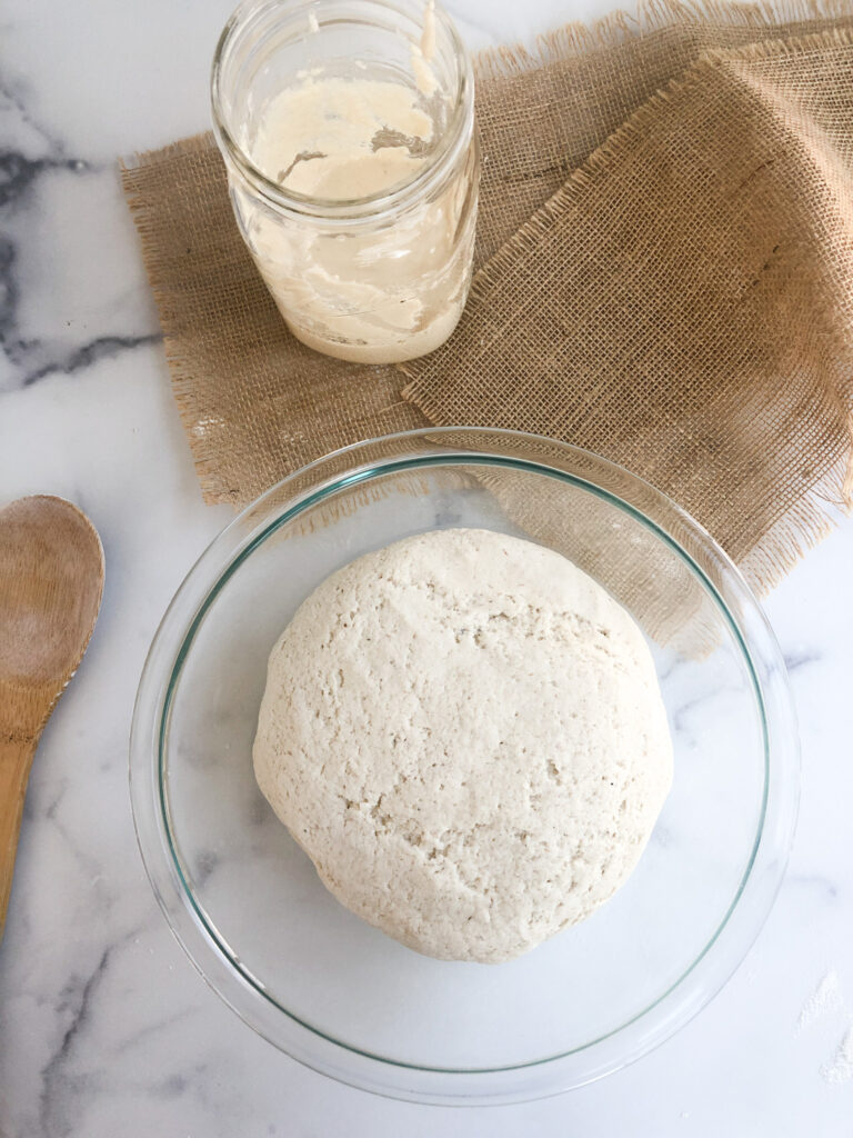 gluten-free sourdough bread dough in a bowl ready to rise