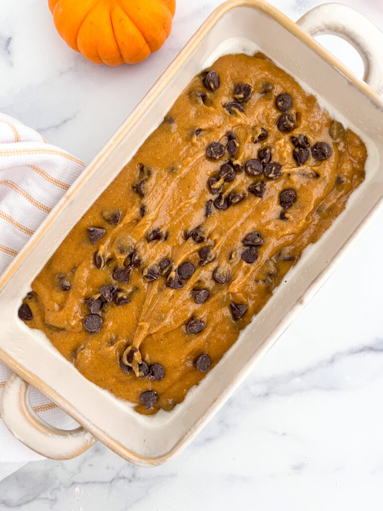uncooked gluten-free chocolate chip pumpkin bread in loaf pan