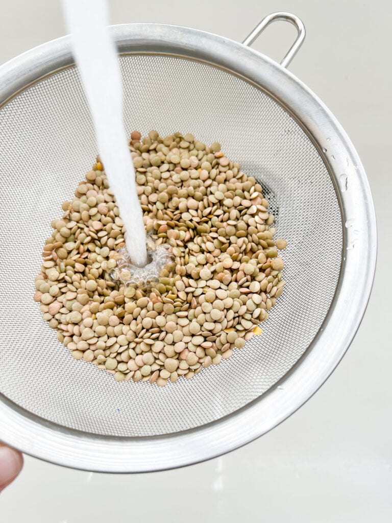 rinsing lentils in a strainer