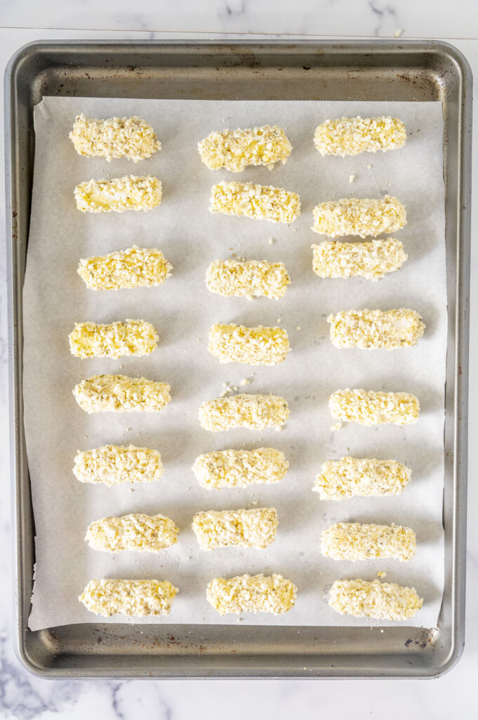 gluten-free mozzarella sticks on a baking sheet