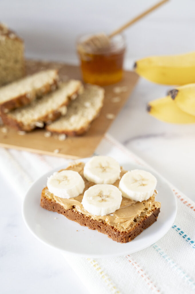 gluten-free oat bread topped with peanut butter and bananas