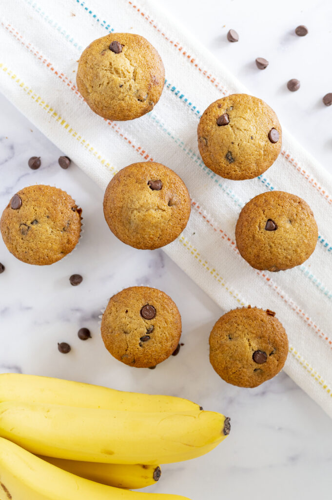 chocolate chip banana muffins on a table 