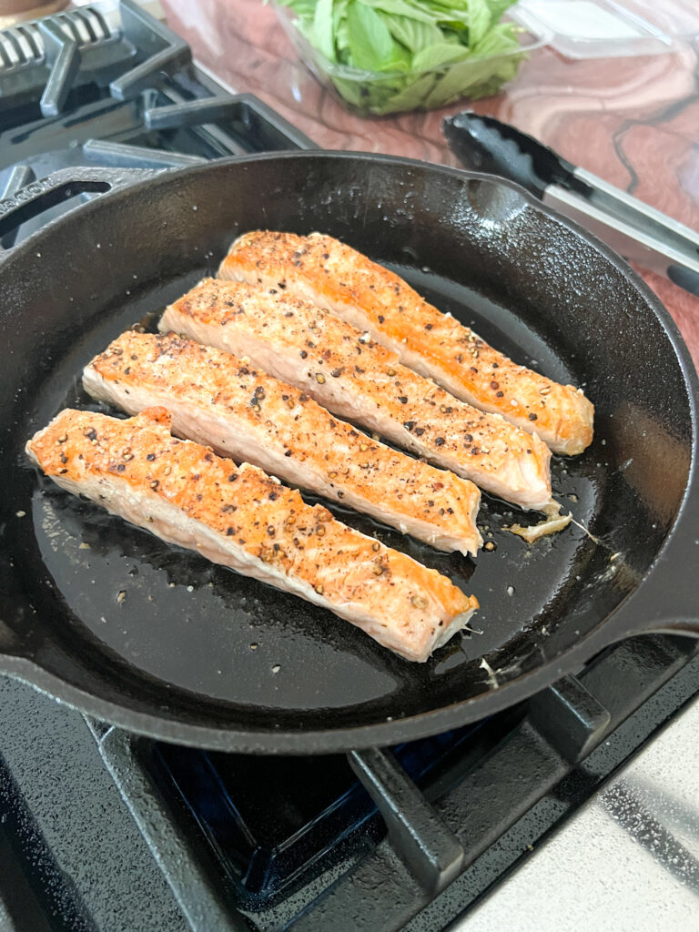seared salmon in cast iron pan