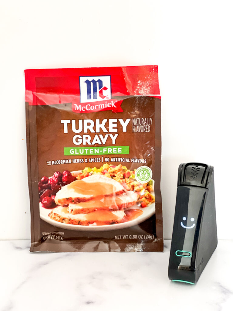 Nima Sensor smiles next to Mccormick gluten-free labeled turkey gravy