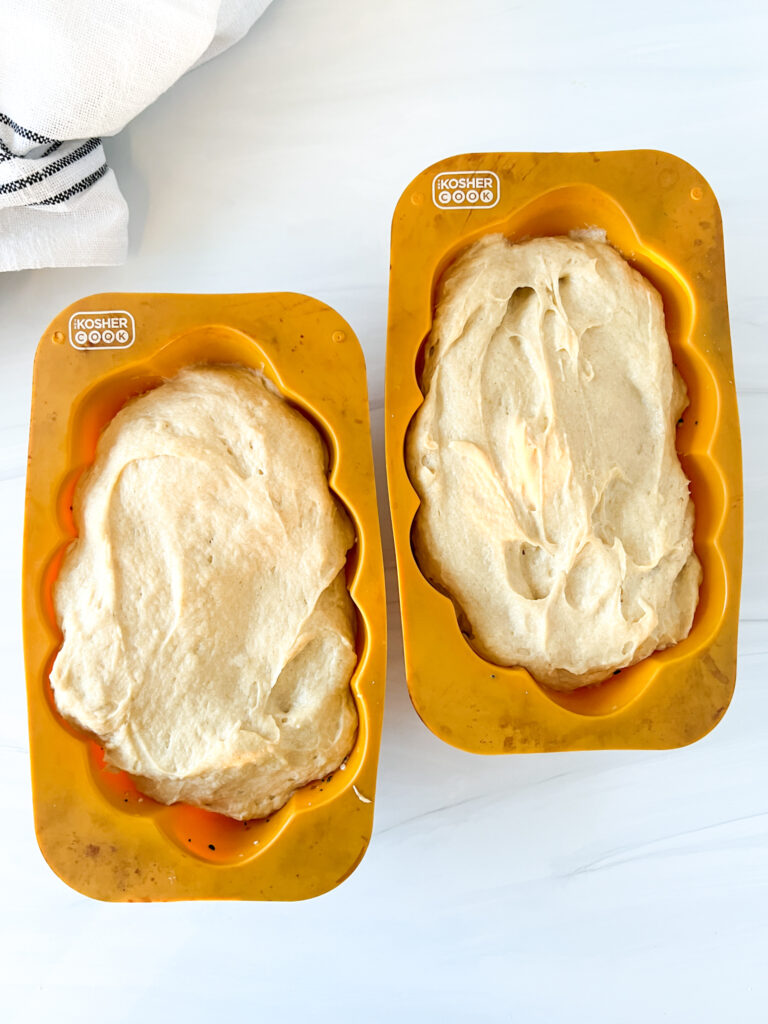 dough rose inside challah pans