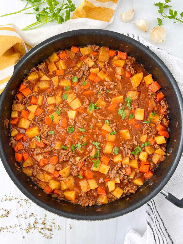 ground beef and potato stew in a pot