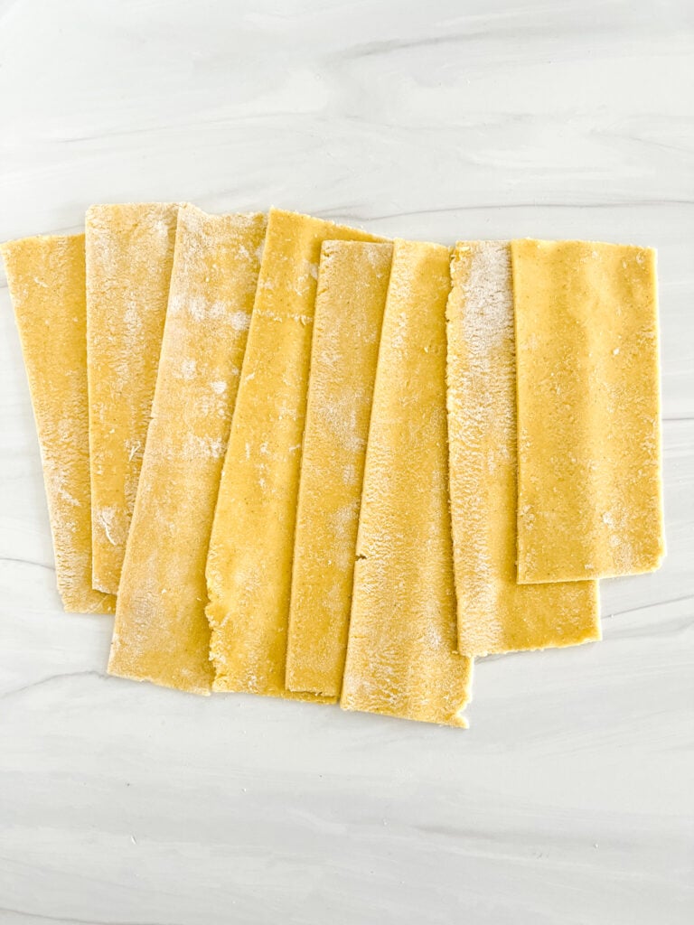 pasta sheets rolled through pasta machine