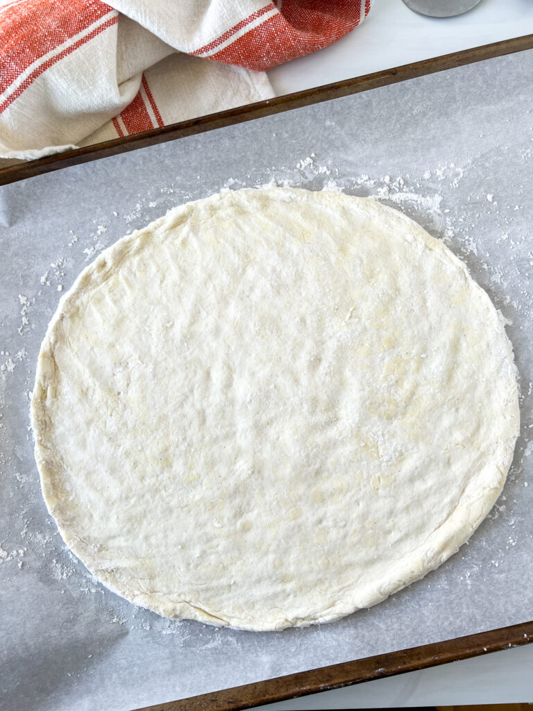 caputo pizza crust on parchment paper - uncooked