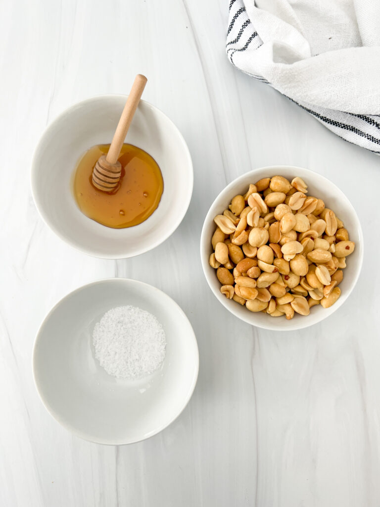 peanuts, honey, and salt on table