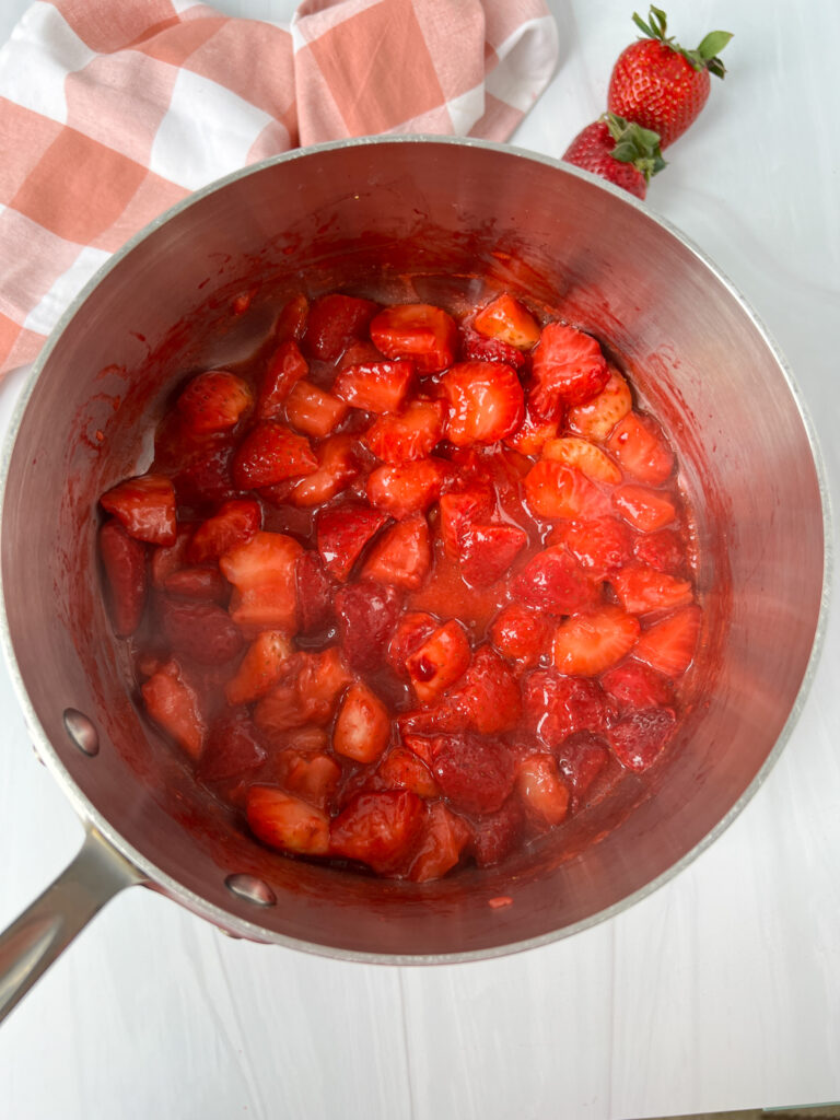 strawberries cooking down in a pot