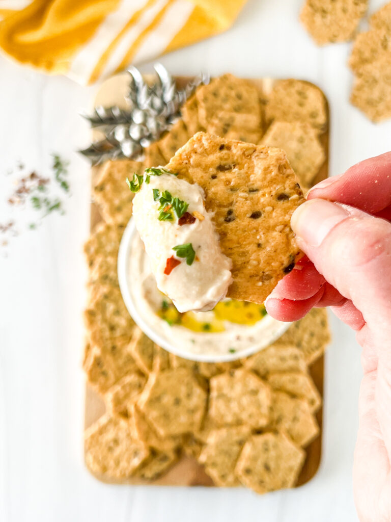 cracker with white bean dip on top