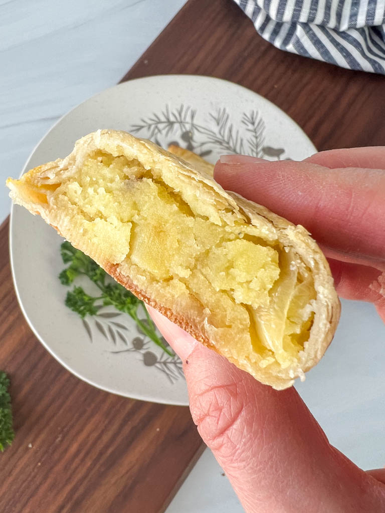 knish cut in half to expose potato filling