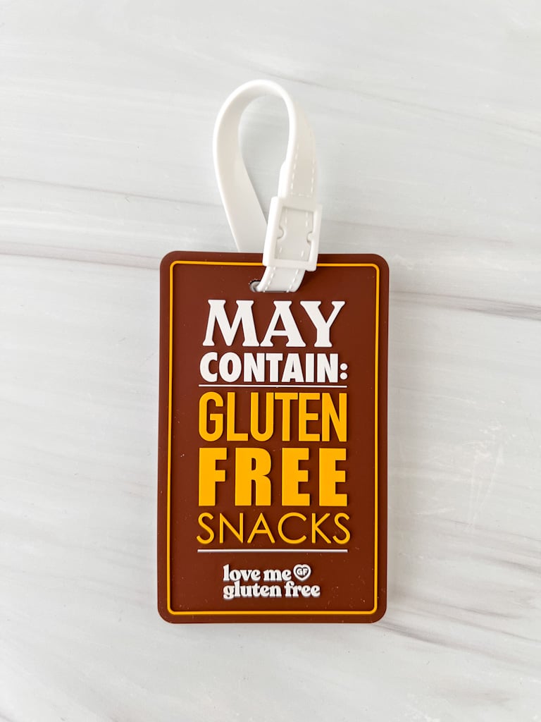 love me gluten free luggage tag that says: May contain gluten-free snacks